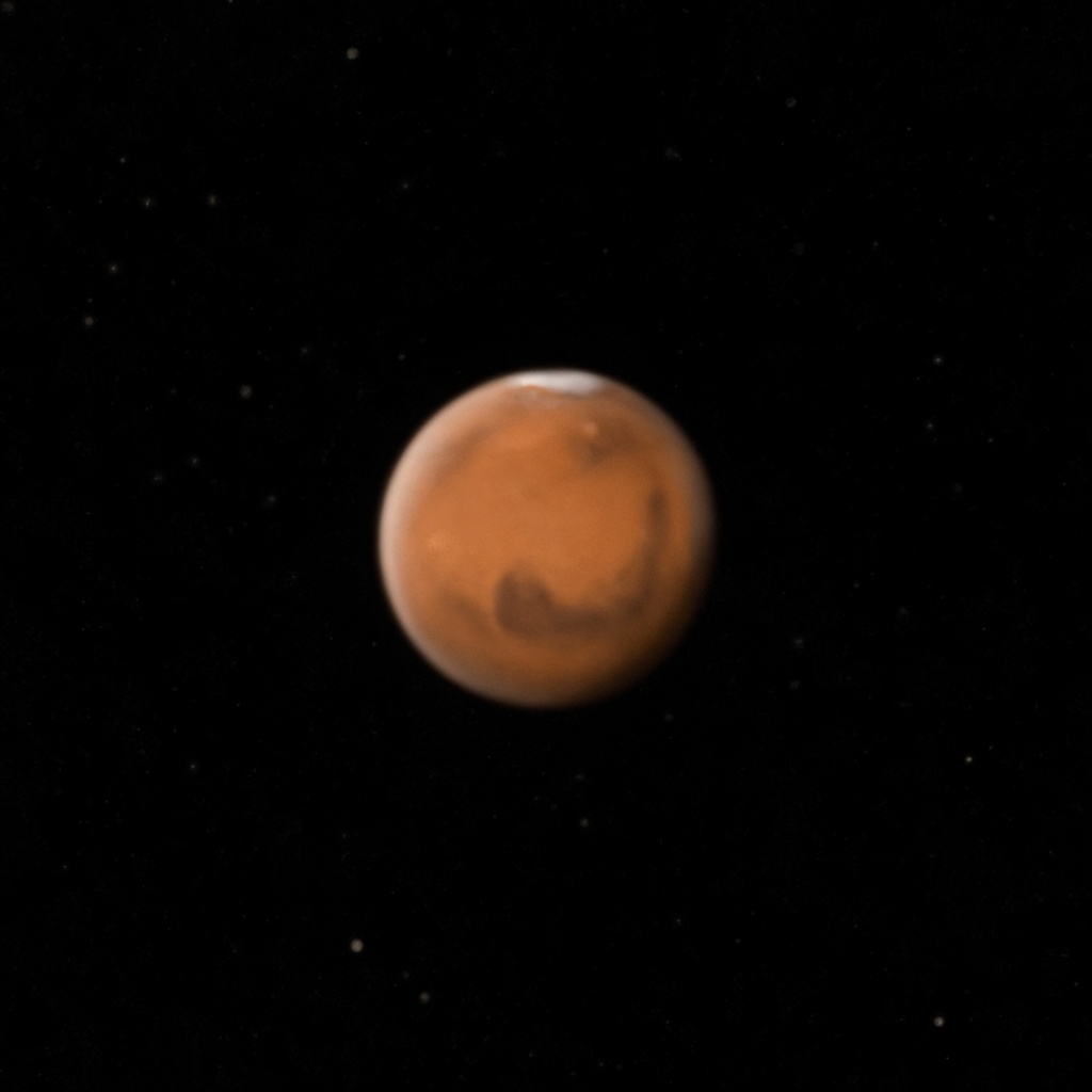 Mars, petit disque orangé avec calotte et marques de surface